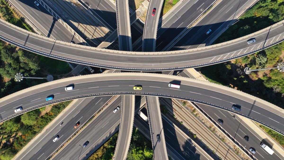 Aerial drone top down photo of urban multilevel highway junction with light traffic