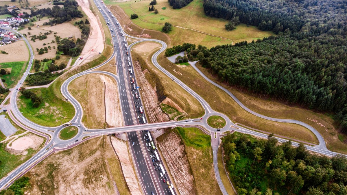 Aerial view of highway junction, green forest, Netherlands