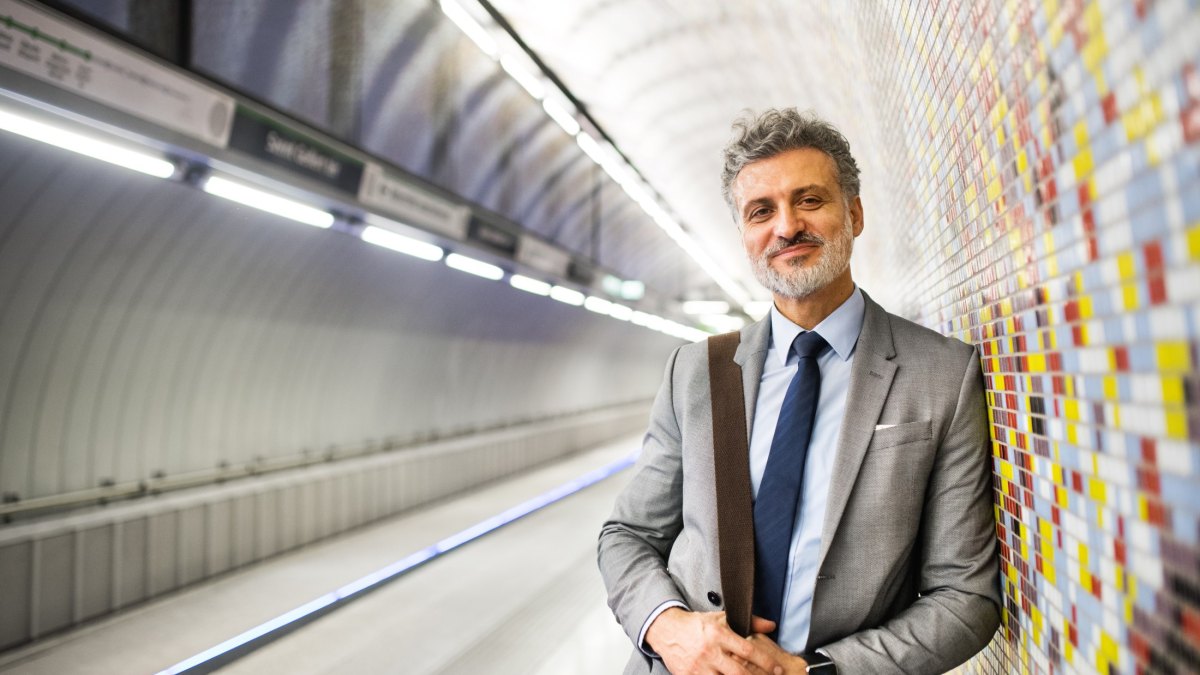 Mature businessman waiting on a metro station.